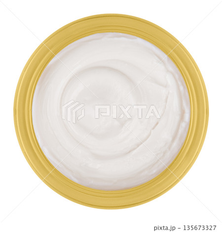 Body cream in a transparent jar on an isolated white background 135673327