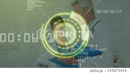 Medical team in white coats with stethoscope reviewing clipboard data in clinic, with HUD overlay 135673433