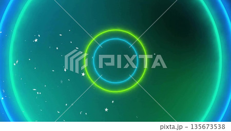Emitting concentric neon rings creating blue green glow in space, with star-shaped particles Emitting concentric neon rings creating blue green glow in space, with star-shaped particles 135673538