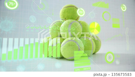 Displaying neon green tennis ball pyramid on studio table with bar, line, circle, numeric overlays Displaying neon green tennis ball pyramid on studio table with bar, line, circle, numeric overlays 135673583