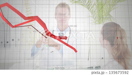 Analyzing red downward graph on digital display at clinic, doctors comparing tablet and documents Analyzing red downward graph on digital display at clinic, doctors comparing tablet and documents 135673592