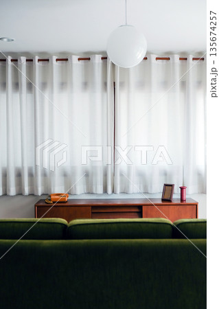 interior of a living room with green sofa and lamp interior of a living room with green sofa and lamp 135674257