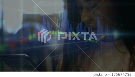 Holding Asian woman analyzing smartphone in dim office, with candlestick chart overlay, copy space Holding Asian woman analyzing smartphone in dim office, with candlestick chart overlay, copy space 135674752