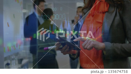 Tapping tablet businesswoman focusing in office area, with stock chart overlays, copy space Tapping tablet businesswoman focusing in office area, with stock chart overlays, copy space 135674758
