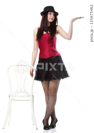 showgirl woman dance in red corset chair white isolated 135675462