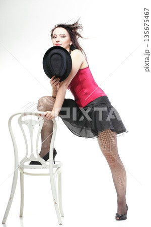 showgirl woman dance in red corset chair white isolated showgirl woman dance in red corset chair white isolated 135675467
