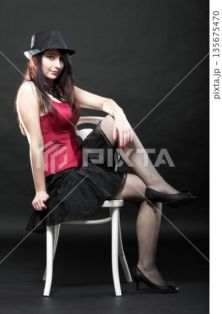 showgirl woman dance in red corset chair white isolated showgirl woman dance in red corset chair white isolated 135675470