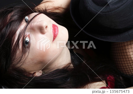 Portrait woman in red corset 135675473