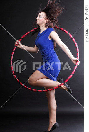 Dance hoop Beautiful woman in blue Dance hoop Beautiful woman in blue 135675479
