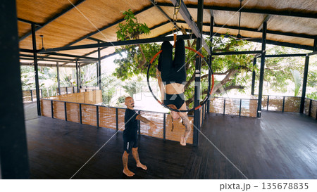Aerialist training on lyra hoop with instructor in costa rica Aerialist training on lyra hoop with instructor in costa rica 135678835