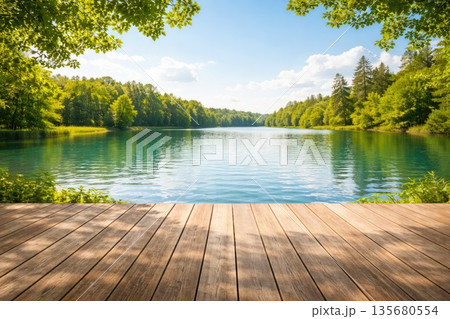 Wooden Pier by Calm Lake Surrounded by Green Forest 135680554