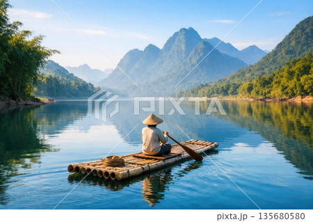 Traditional Bamboo Raft Floating on Scenic River 135680580