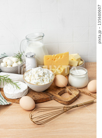 Assortment of fresh dairy products and eggs on wood Assortment of fresh dairy products and eggs on wood 135680607