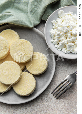 Frozen cottage cheese pancakes ready for cooking Frozen cottage cheese pancakes ready for cooking 135680620