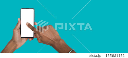 African American man using smartphone, typing or browsing online, symbolizing communication, 135681151