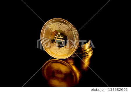 Cardano coins on black background. Cryptocurrency concept. Cardano coins on black background. Cryptocurrency concept. 135682693