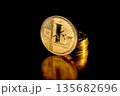 Litecoin cryptocurrency. Gold coins on black background. 135682696