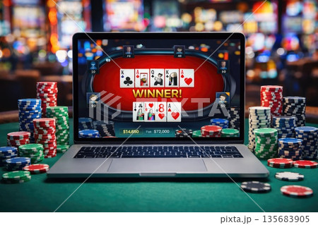 Online Poker Game on Laptop with Casino Chips and Cards in Gambling Concept Online Poker Game on Laptop with Casino Chips and Cards in Gambling Concept 135683905