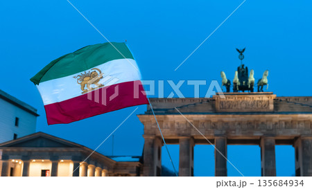 Iranian flag during demonstration in support of Iran near Brandenburg Gate 135684934