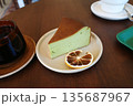 korea cafe slice of matcha cheesecake on a white plate 135687967