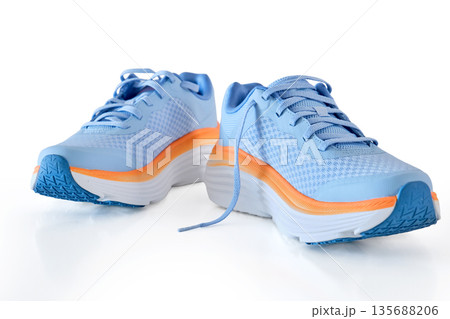 Blue orange running shoes for athletic activity 135688206