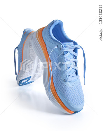 Blue and orange running shoes on white background Blue and orange running shoes on white background 135688213
