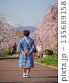 Chinese woman admiring flowers at the Nicchu Line in Fukushima, Japan 135689158