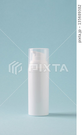 White cosmetic bottle on blue background 135689382