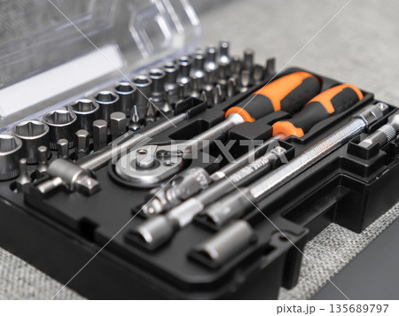 Comprehensive tool set containing various sockets, screwdriver bits, and a powerful ratchet wrench, ideal for home improvement, professional, and mechanical work Comprehensive tool set containing various sockets, screwdriver bits, and a powerful ratchet wrench, ideal for home improvement, professional, and mechanical work 135689797