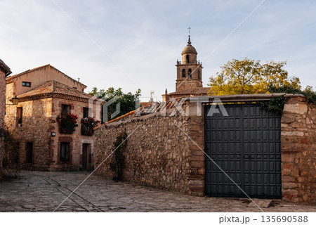Medinaceli old village street with stone houses and church Medinaceli old village street with stone houses and church 135690588