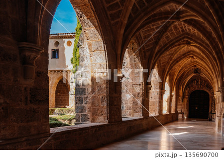 Monasterio de Piedra cloister with stone arches and sunlight in Zaragoza, Spain 135690700