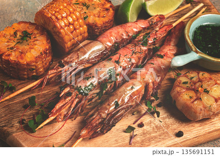langoustines on skewers, shrimp kebab, with fried corn, spices and herbs, homemade, no people, 135691151