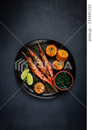 langoustines on skewers, shrimp kebab, with fried corn, spices and herbs, homemade, no people, 135691152