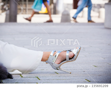 Woman wearing high heels and culottes 135691209