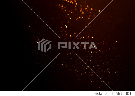 Golden abstract bokeh on black background. Golden abstract bokeh on black background. 135691301