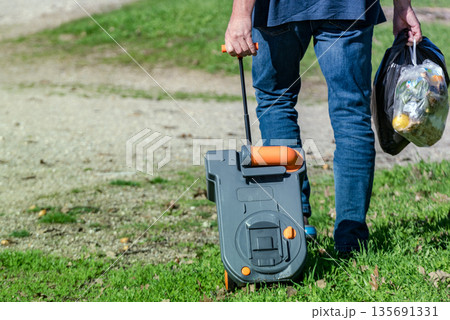 Man serving caravan, go with tank toilet cassette to dump station. Man serving caravan, go with tank toilet cassette to dump station. 135691331