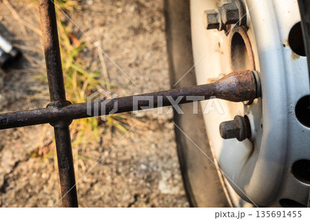 Fixing car tire with rim socket wrench Fixing car tire with rim socket wrench 135691455
