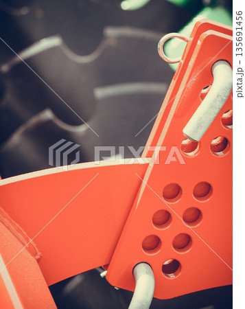Detailed closeup of disc harrow agricultural machinery Detailed closeup of disc harrow agricultural machinery 135691456