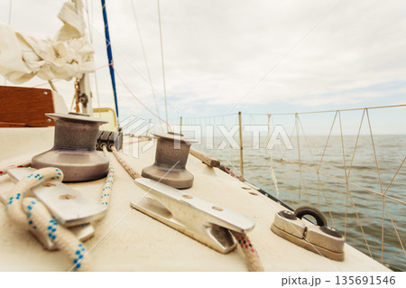 Yacht capstan on sailing boat during cruise Yacht capstan on sailing boat during cruise 135691546
