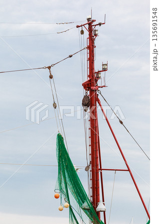 Yachting, many ropes and fishing nets on sailing boat. Yachting, many ropes and fishing nets on sailing boat. 135691548