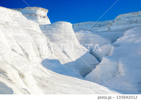White chalk cliffs in Sarakiniko, Milos island, Cyclades, Greece White chalk cliffs in Sarakiniko, Milos island, Cyclades, Greece 135692012