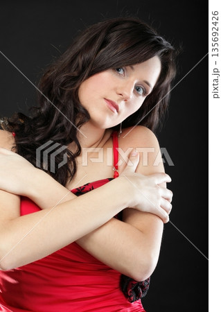 Portrait woman in red corset 135692426