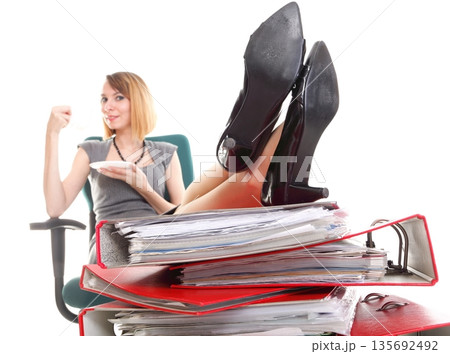 Woman work stoppage businesswoman relaxing legs up plenty of documents isolated 135692492