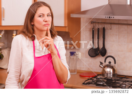 Thinking housewife at home Thinking housewife at home 135692872