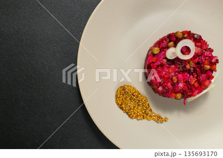 Classic Russian Beet Salad with Mustard Seeds on Plate. Vinaigrette Classic Russian Beet Salad with Mustard Seeds on Plate. Vinaigrette 135693170