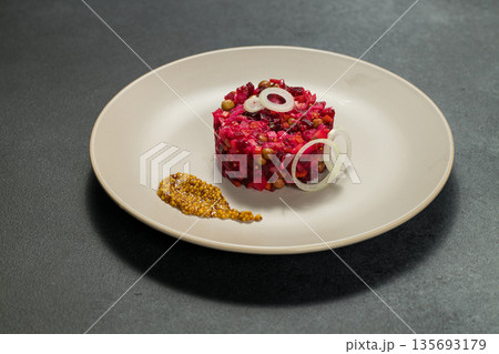 Classic Russian Beet Salad with Mustard Seeds on Plate. Vinaigrette Classic Russian Beet Salad with Mustard Seeds on Plate. Vinaigrette 135693179