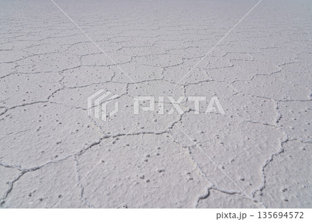 Abstract texture of white hexagonal salt crust in Salar de Uyuni, Bolivia 135694572