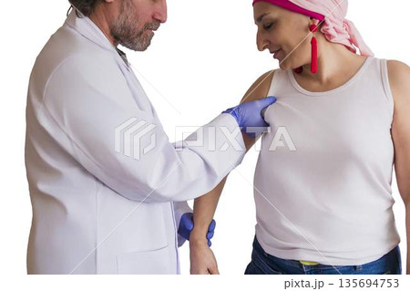 Doctor performing breast cancer screening on woman Doctor performing breast cancer screening on woman 135694753