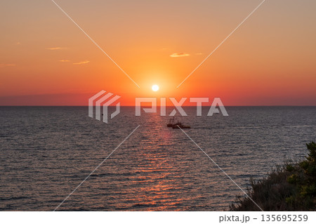 Beautiful red and orange sunrise over the sea. 135695259