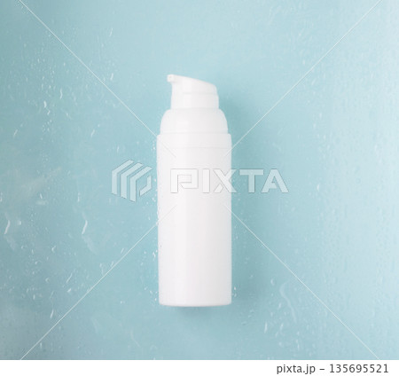 Skincare hydration background with water drops and cosmetic bottle 135695521